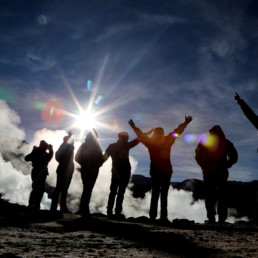 People looking at a geyser