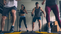 Group of men and women doing ladder exercises